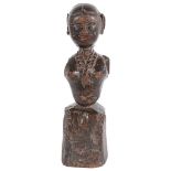 A Tribal Carving: 18th Century, carved wooden bust of a woman,