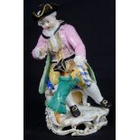 A 19th Century Meissen Figure of a Seated Gentleman: Holding a hoop with a dog.