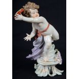 A 19th Century Meissen Figure of a Wingless Cupid: Holding a tambourine, standing on steps.