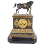 A 19th Century Russian Clock: The cast spelter figure to the top of a horse with saddle tied to a