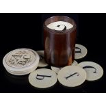 A Collection of 19th Century Ivory Alphabetic Counters: Roundels of ivory carved with Arabic