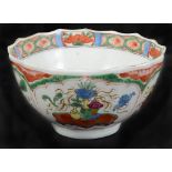 A Worcester Tea Bowl: 18th century, 1st period, polychrome decorated with dragons & utensil designs.