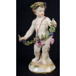 A 19th Century Meissen Figure of a Putto: Holding a garland of grapes.