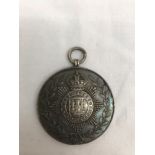 A hallmarked silver East Surrey 1st Battallion medallion