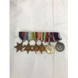 WWII Medal group court mounted to include 39-45, Atlantic, Africa, Italy, BWM and oak leaf,