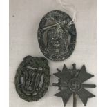 Three WWII breast badges to inc 1st Class Merit