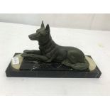 An Art Deco figure of a German Shepherd on a marble base