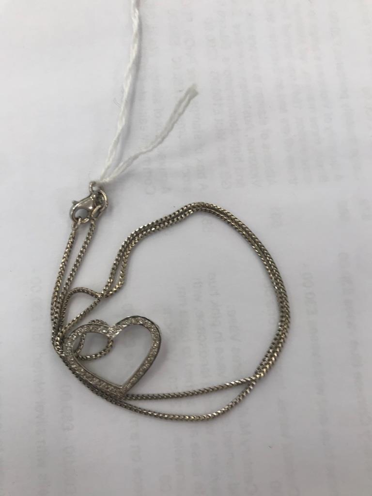 An 18ct Theo Fennell chain and 18ct diamond set heart