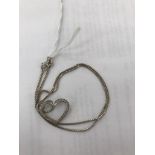 An 18ct Theo Fennell chain and 18ct diamond set heart