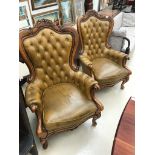 A pair of victorian style leather button-back chairs