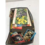 A box of trade cards and cigarette cards