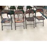 Four painted folding chairs