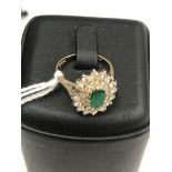 An 18ct diamond and emerald dress ring (A/F)