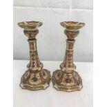 A pair of Royal Crown Derby Imari candlesticks