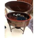 An oval table-cased Tyrela gramophone