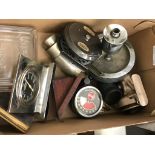 A box of odds to inc fishing reels, Ritz ashtrays, thermometers,