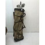 A bag of vintage golf clubs