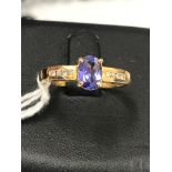 An 18ct tanzanite and diamond set dress ring