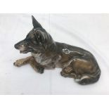 A Royal Copenhagen figure of a recumbent German Shepherd