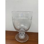 A large glass goblet, marked 'Reform, W. C.