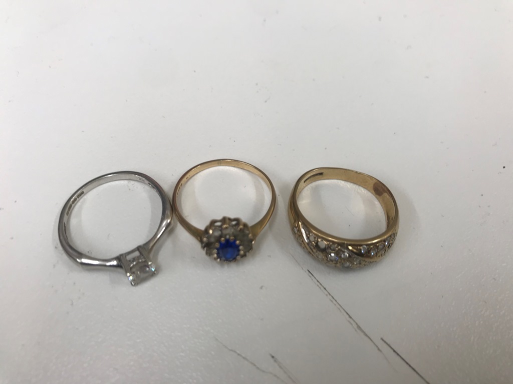 Three 9ct dress rings (one missing a stone).