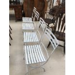 Four outdoor iron chairs painted in white