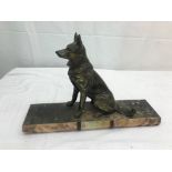 A Deco figure of a German Shepherd on a marble base