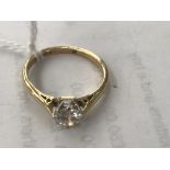 An 18ct gold diamond solitaire ring: 0.