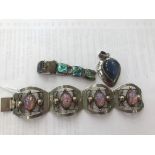 A silver opal-style bracelet;