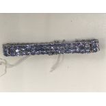 A silver and tanzanite bracelet: three rows of tanzanite - 33.