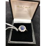 A diamond and sapphire daisy ring,