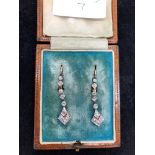 A boxed pair of Edwardian diamond drop earrings