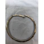 A cased silver and gold choker necklace