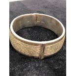 A bark engraved silver bangle