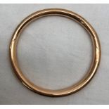 A 9ct gold bangle