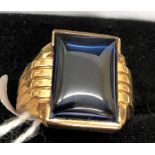 A gentleman's 10k blue stone set ring