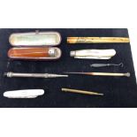 A quantity of pens, cheroot holder,