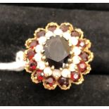 A 9ct opal and garnet dress ring