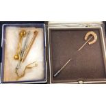 A quantity of gold tie pins & bar brooches