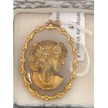 A 9ct gold cameo on a hardstone diamond setting