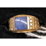 A gentleman's 10k sapphire and diamond set ring