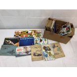 A quantity of WWII cigarette card albums