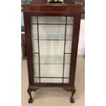 An early 20th century glass-fronted display cabinet