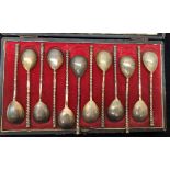 A cased set of 12 Russian silver teaspoons with twist handles,