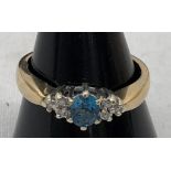 A diamond and topaz dress ring