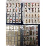 Two albums of cigarette cards to inc military examples