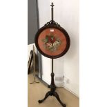 A 19th century embroidered pole screen