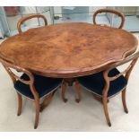 A modern mahogany dining table;
