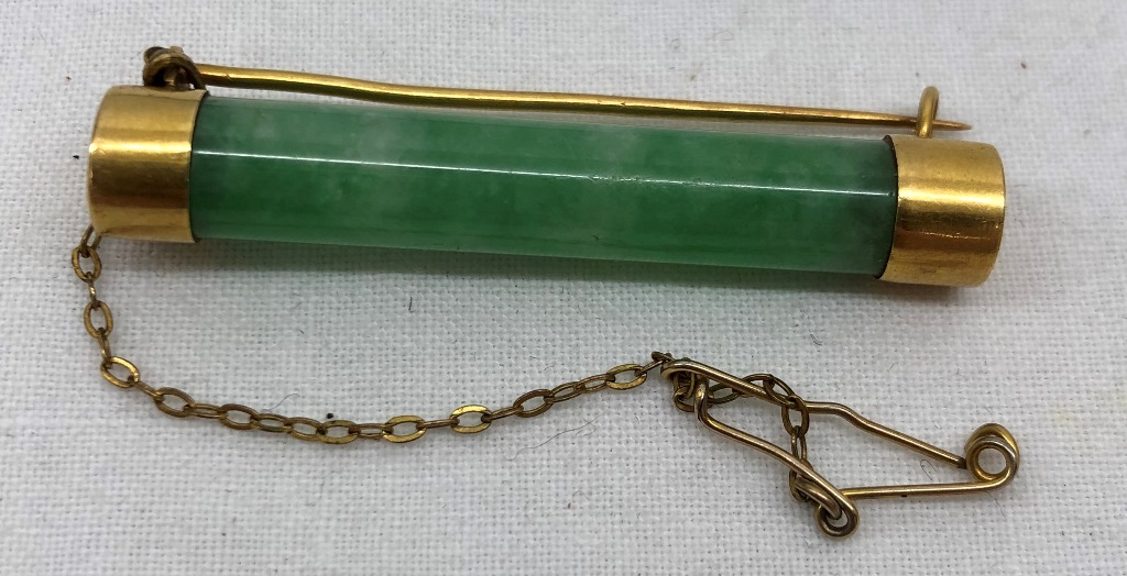 A Woo Hing 20 jade bar brooch,