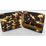 A gold hinged tortoiseshell cigarette case by Aspreys